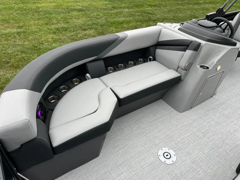 Slide: The Image of 2025 South Bay S224 UL boat interior with sleek gray seating and cup holders. - 8