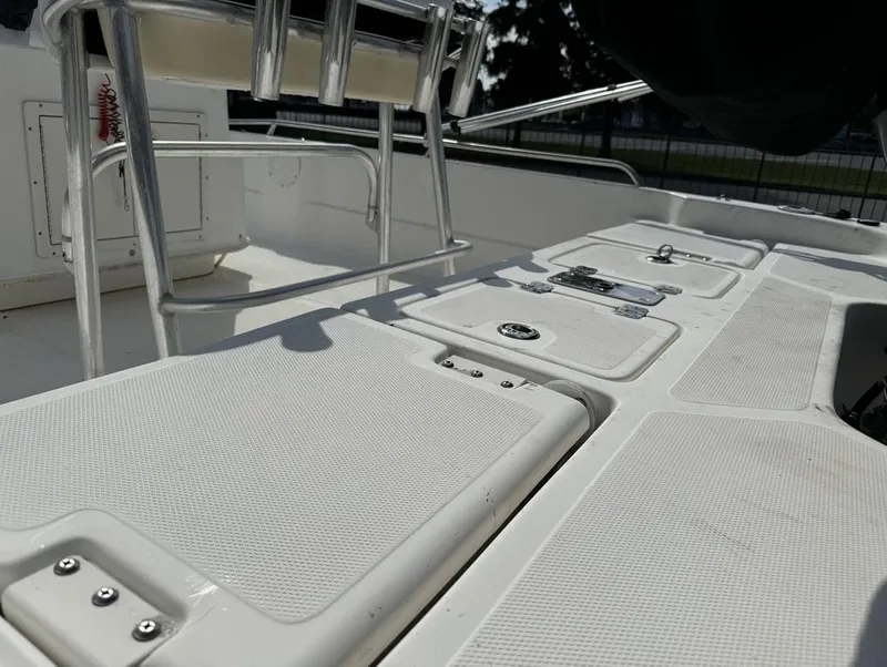 Slide: The Image of 2008 NauticStar 2200 Nauticbay boat deck with storage compartments and seating. - 13