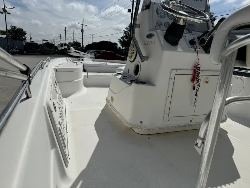 Slide: The Image of 2008 NauticStar 2200 Nauticbay boat interior with steering console and seating area. - 14