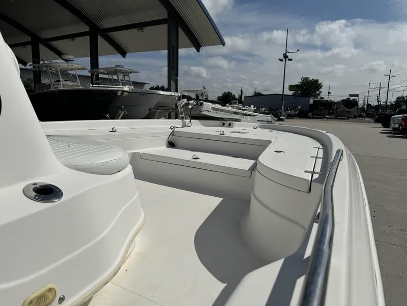 Slide: The Image of 2008 NauticStar 2200 Nauticbay boat displayed at a marina under a clear sky. - 17