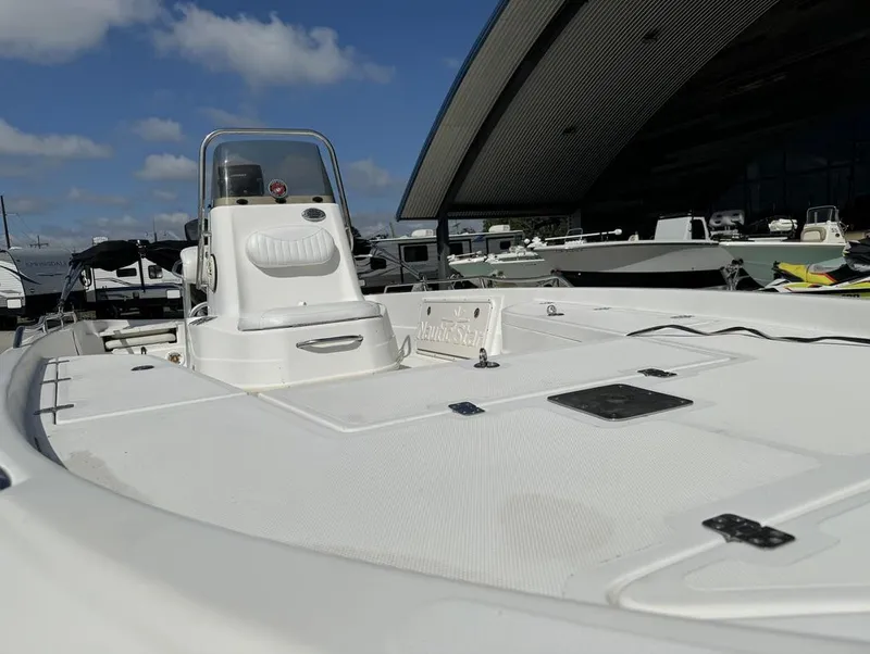 Slide: The Image of 2008 NauticStar 2200 Nauticbay boat docked under blue sky. - 20