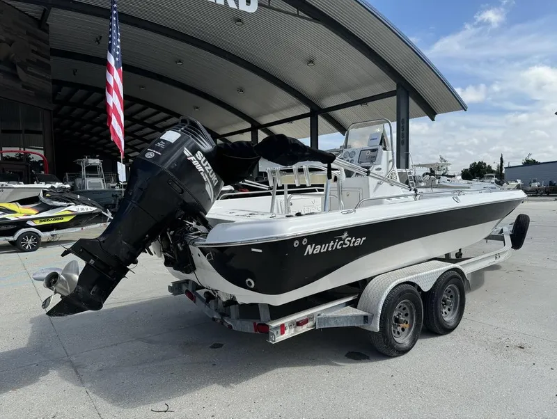 Slide: The Image of 2008 NauticStar 2200 Nauticbay boat on trailer with Suzuki outboard motor. - 4