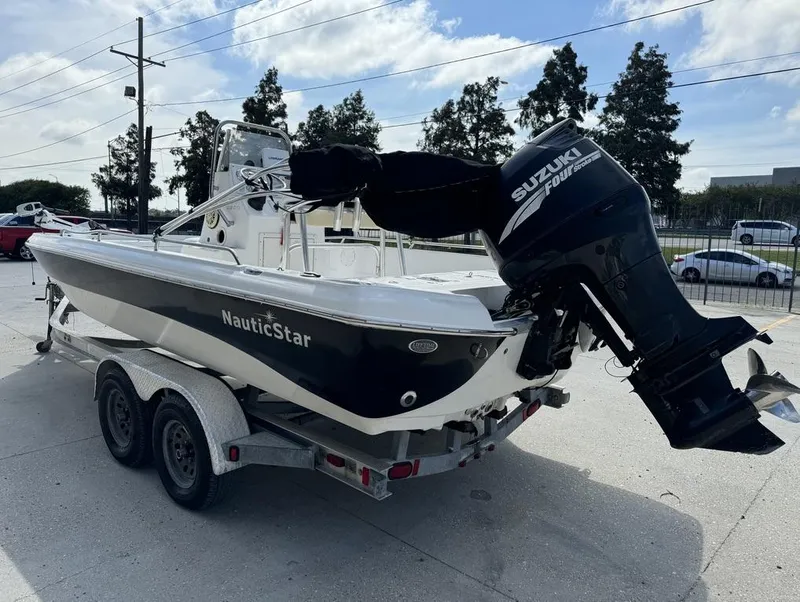 Slide: The Image of 2008 NauticStar 2200 Nauticbay boat on trailer with Suzuki outboard motor. - 5