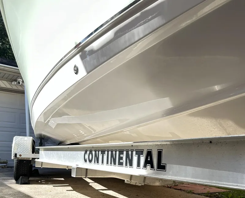 Slide: The Image of 2022 Sea Hunt Ultra 234 boat on Continental trailer, side view. - 14