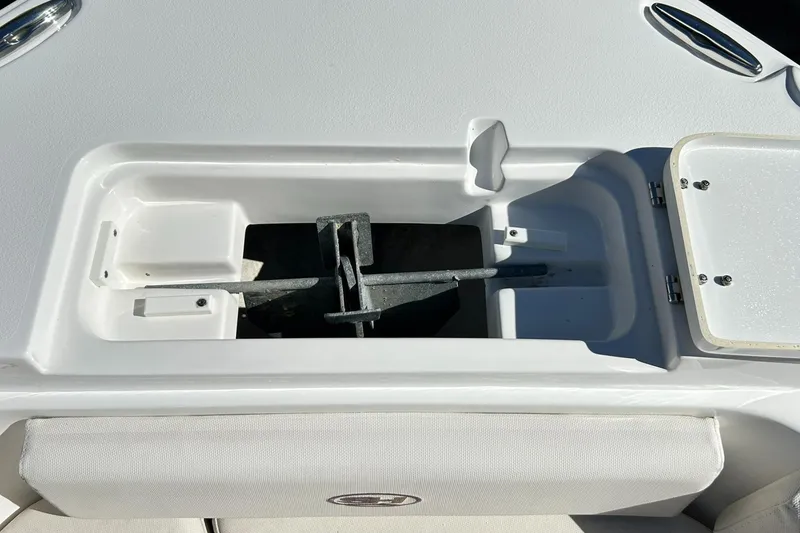 Slide: The Image of Anchor storage compartment on a 2022 Sea Hunt Ultra 234 boat. - 22