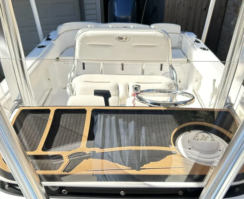 Slide: The Image of 2022 Sea Hunt Ultra 234 boat interior with sleek design and modern controls. - 25
