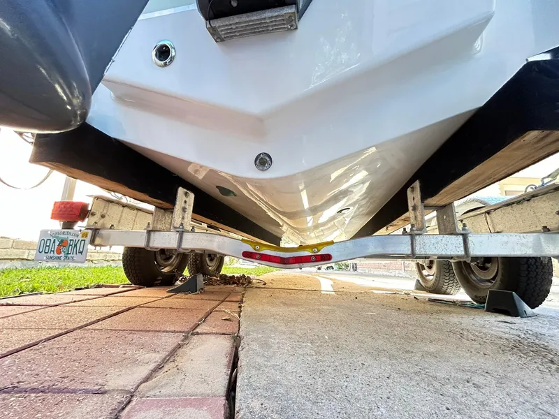 Slide: The Image of 2022 Sea Hunt Ultra 234 boat on trailer, viewed from below. - 8