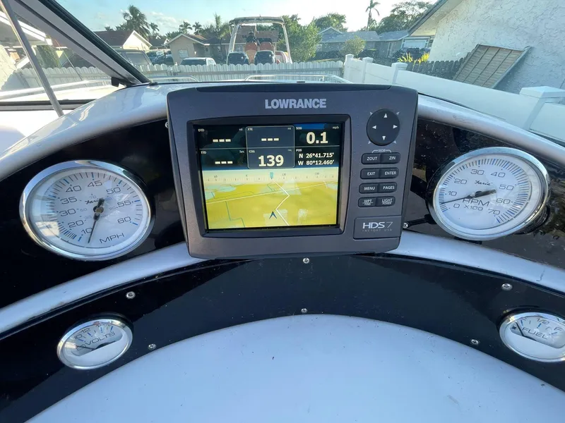 Slide: The Image of Dashboard of a 2001 Hurricane 232 OB boat with Lowrance GPS and gauges. - 18