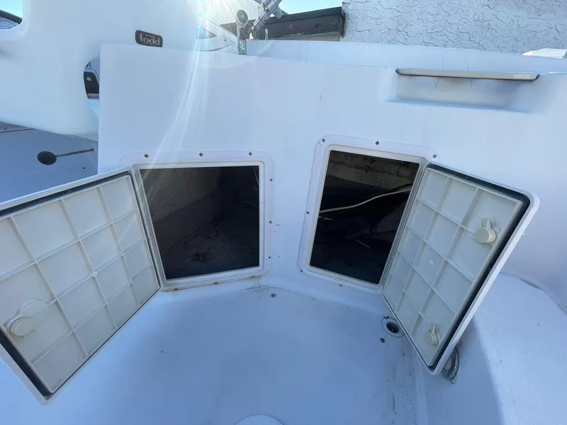 Slide: The Image of Open storage compartments on a 2001 Hurricane 232 OB boat. - 26