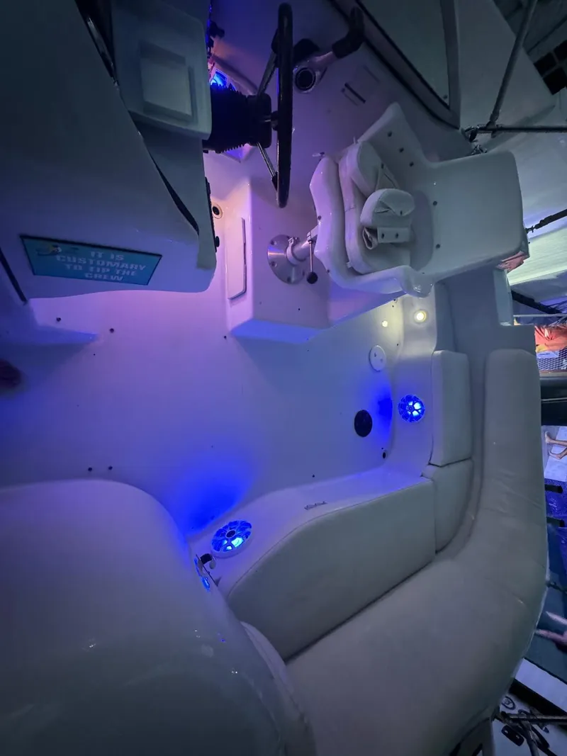 Slide: The Image of Interior of 2001 Hurricane 232 OB boat with blue LED lighting. - 27