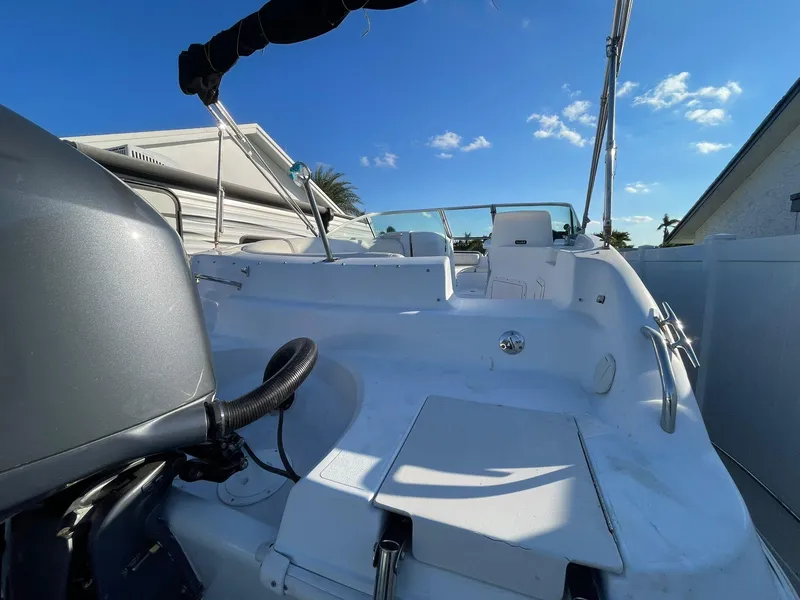 Slide: The Image of 2001 Hurricane 232 OB boat with outboard motor, sunny day, clear blue sky. - 6