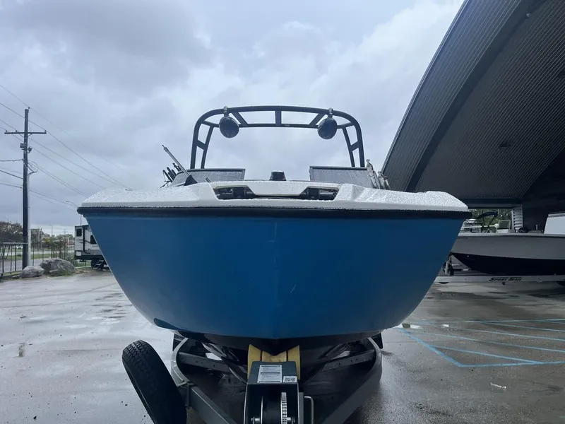 Slide: The Image of 2023 Yamaha AR250 boat on trailer in a parking lot. - 11