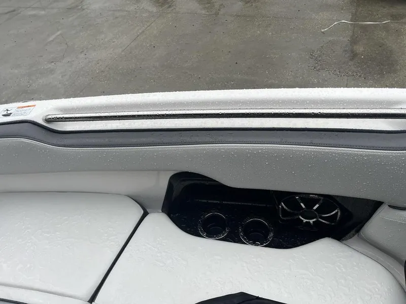 Slide: The Image of 2023 Yamaha AR250 boat interior with wet seats and cup holders. - 22