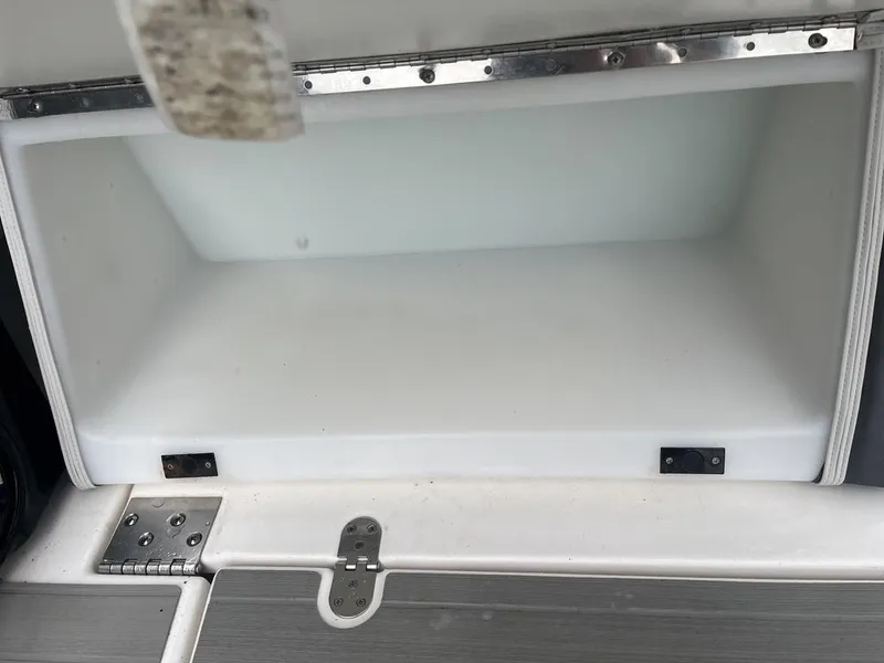 Slide: The Image of 2023 Yamaha AR250 boat storage compartment, open and empty. - 5