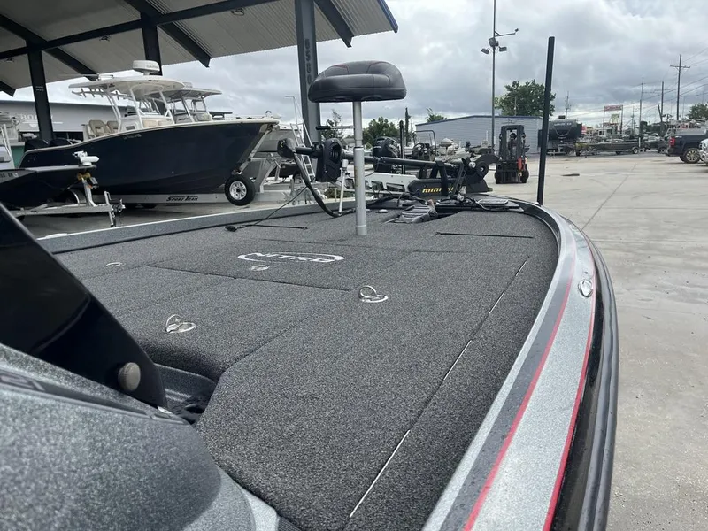 Slide: The Image of 2017 Nitro Z21 boat with fishing deck and seat in a marina setting. - 11