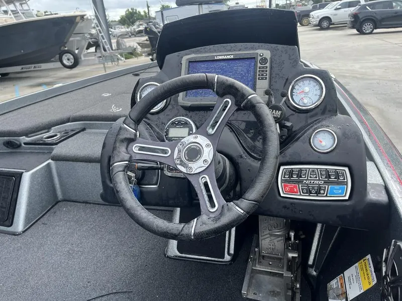 Slide: The Image of Steering console of a 2017 Nitro Z21 boat with gauges and controls. - 17
