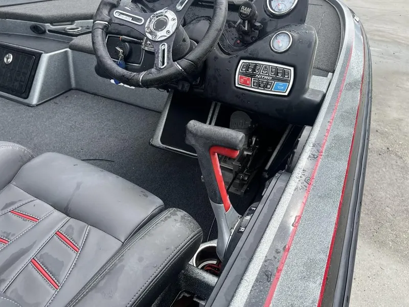 Slide: The Image of 2017 Nitro Z21 boat cockpit with steering wheel and control panel. - 18