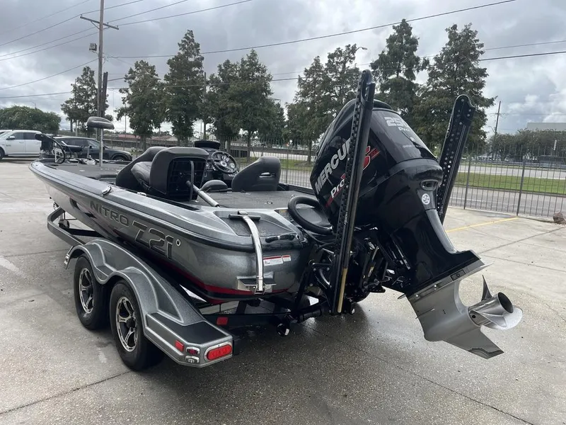 Slide: The Image of 2017 Nitro Z21 boat with Mercury engine on trailer in parking lot. - 4