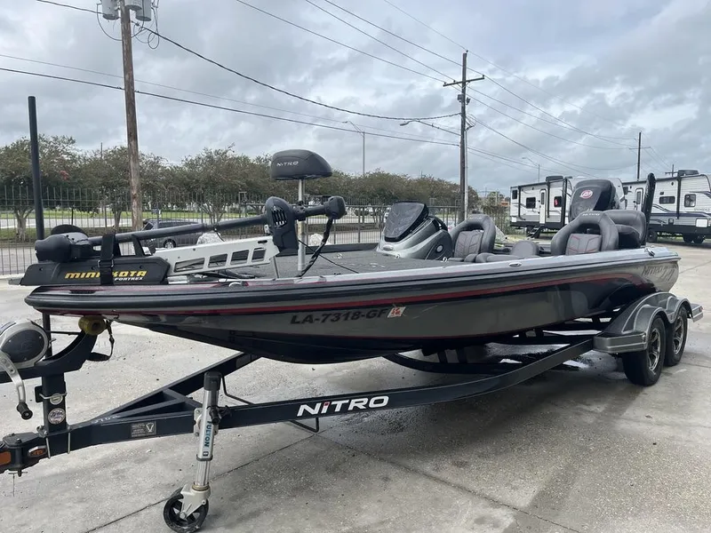 Slide: The Image of 2017 Nitro Z21 fishing boat on trailer, parked outdoors. - 6