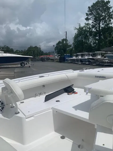 Slide: The Image of 2021 Everglades 253 Center Console boat in a marina setting. - 4