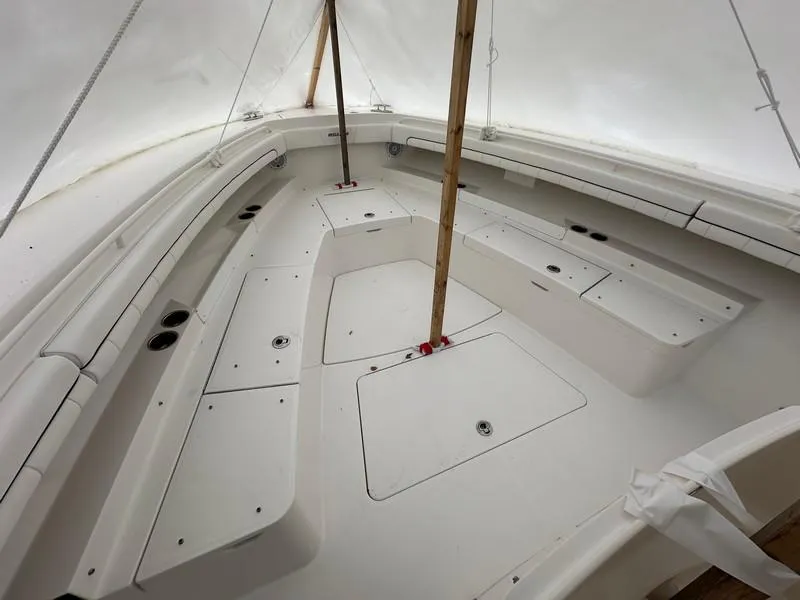 Slide: The Image of 2016 Regulator 41 boat interior with spacious seating and storage compartments. - 29