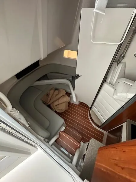 Slide: The Image of Interior cabin of 2016 Regulator 41 boat with seating and wood flooring. - 34