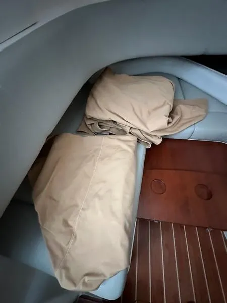 Slide: The Image of Interior of 2016 Regulator 41 boat with beige cushions and wooden flooring. - 37