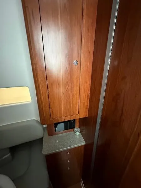 Slide: The Image of 2016 Regulator 41 interior with wooden cabinetry and countertop. - 38