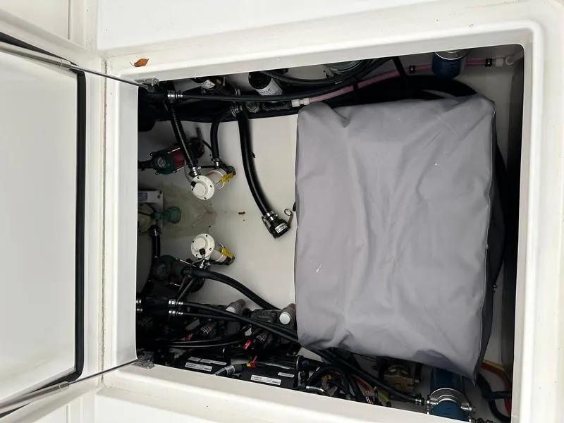 Slide: The Image of Engine compartment of 2016 Regulator 41 boat with covered components and wiring. - 41