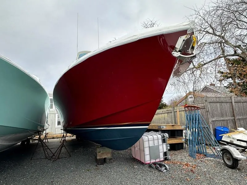Slide: The Image of Red 2016 Regulator 41 boat on dry dock, side view. - 6