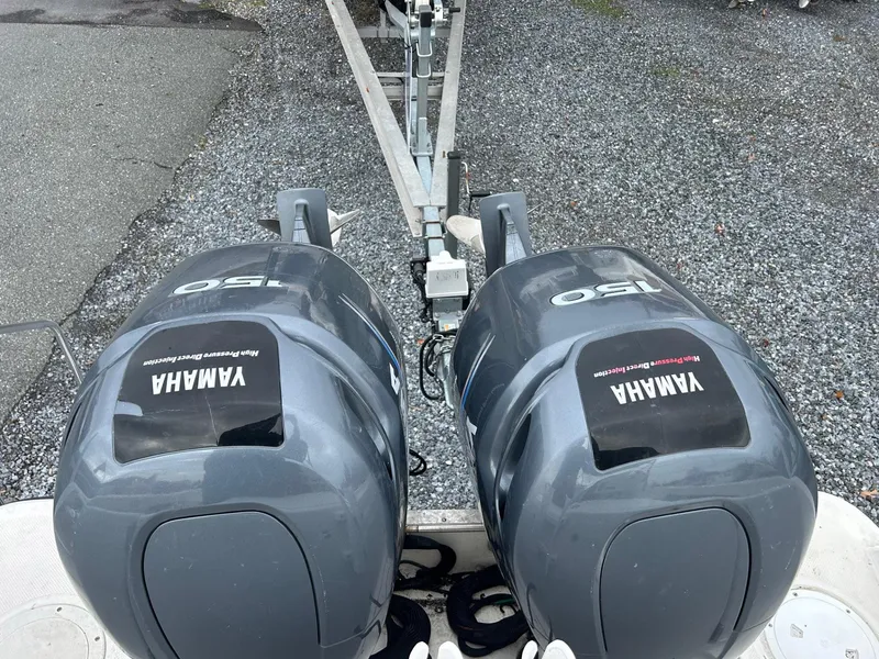 Slide: The Image of Twin Yamaha outboard motors on a 1996 Robalo 2440 Walkaround boat. - 6
