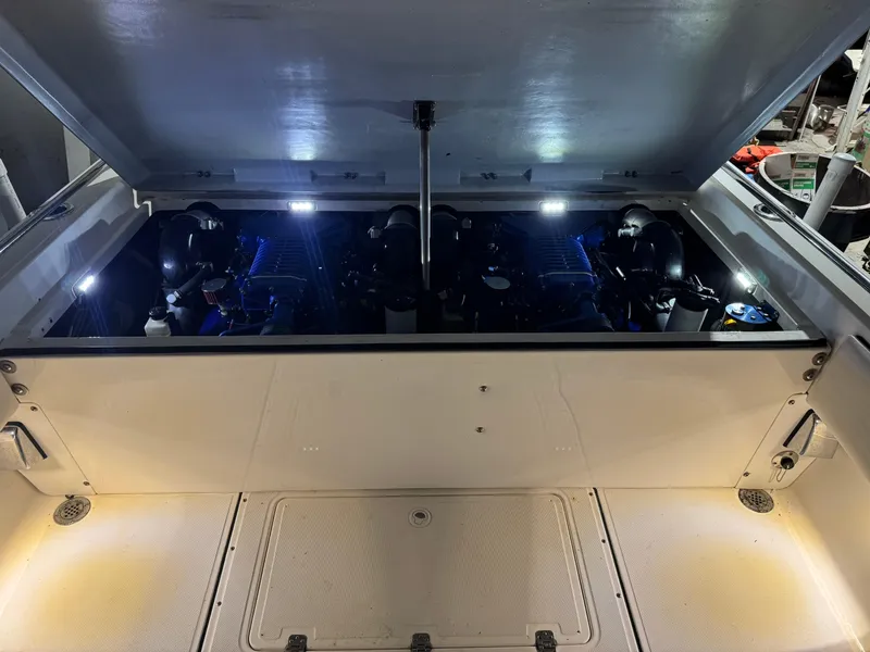 Slide: The Image of Engine compartment of 1996 Fountain 32 Sportfish Cruiser IO, illuminated with LED lights. - 12