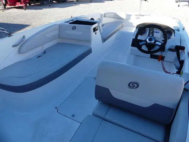 Slide: The Image of 2022 Hurricane SunDeck Sport 185 OB boat interior with steering wheel and seating. - 13