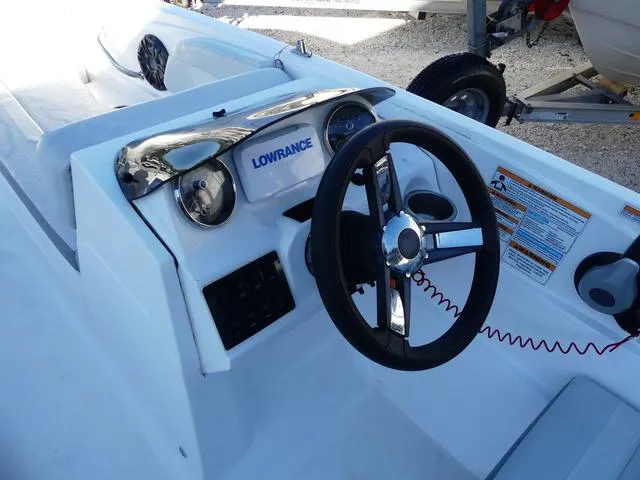 Slide: The Image of 2022 Hurricane SunDeck Sport 185 OB boat dashboard with steering wheel and Lowrance system. - 15
