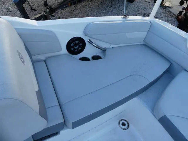 Slide: The Image of 2022 Hurricane SunDeck Sport 185 OB boat interior seating with cup holders and speaker. - 17