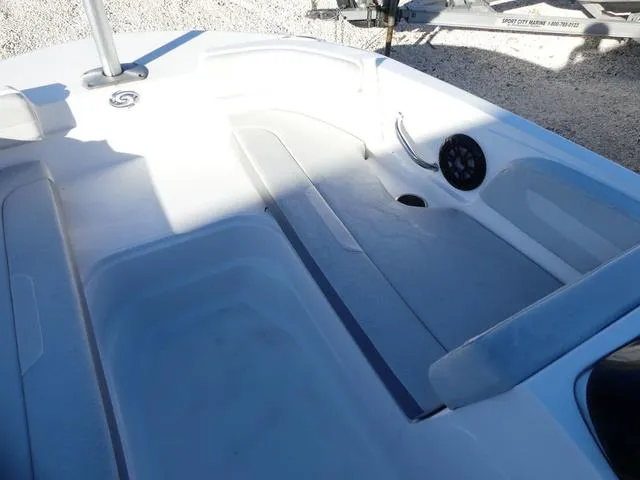 Slide: The Image of 2022 Hurricane SunDeck Sport 185 OB boat interior with seating and speaker. - 22