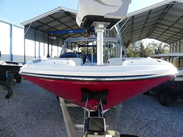 Slide: The Image of 2022 Hurricane SunDeck Sport 185 OB boat on trailer in storage facility. - 4