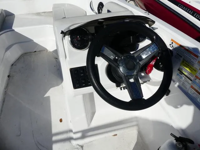 Slide: The Image of 2021 Hurricane SunDeck Sport 185 OB boat steering wheel and dashboard. - 11