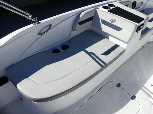 Slide: The Image of 2021 Hurricane SunDeck Sport 185 OB boat interior with seating and cup holders. - 14