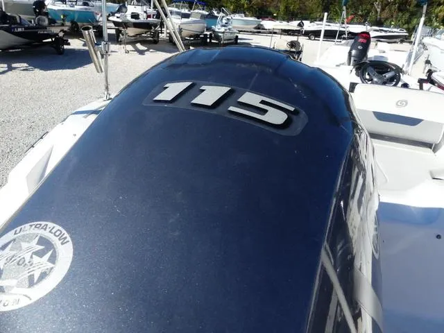 Slide: The Image of 2021 Hurricane SunDeck Sport 185 OB boat with 115 HP engine, parked outdoors. - 7