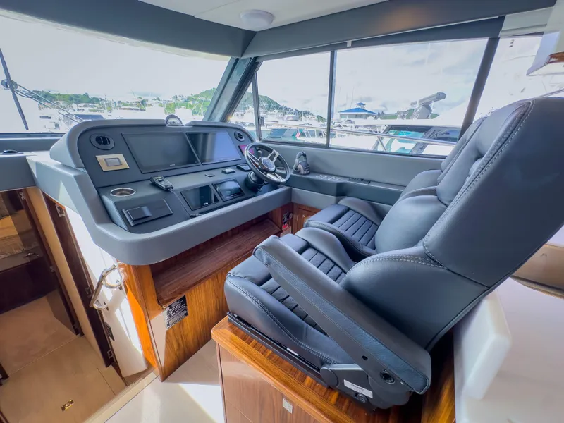 Slide: The Image of 2024 Riviera 465 SUV helm with luxurious seating and modern controls. - 3