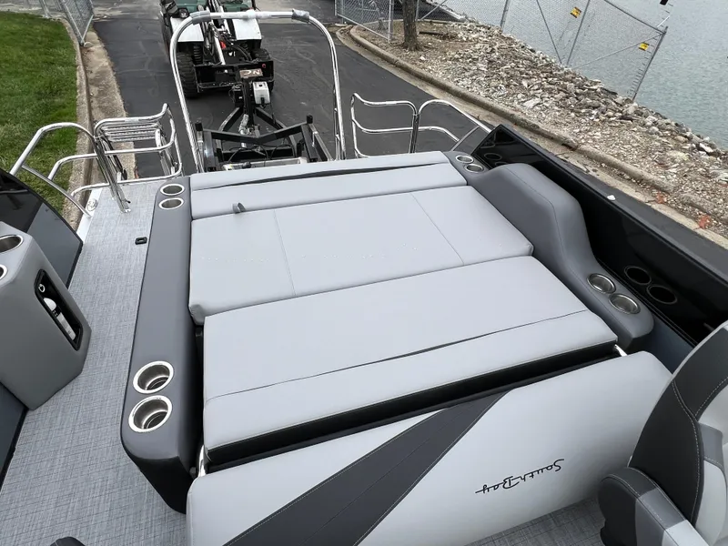 Slide: The Image of 2025 South Bay S222 UL pontoon boat with spacious seating and cup holders. - 15