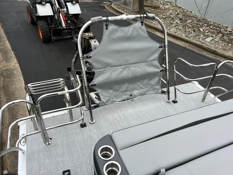 Slide: The Image of 2025 South Bay S222 UL pontoon boat with sleek seating and stainless steel railings. - 16