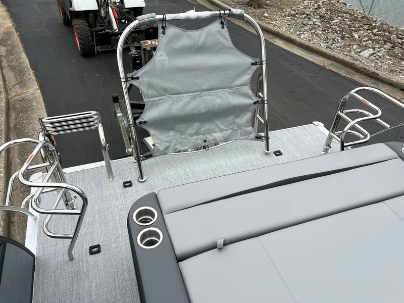 Slide: The Image of 2025 South Bay S222 UL pontoon boat with gray seating and cup holders. - 17