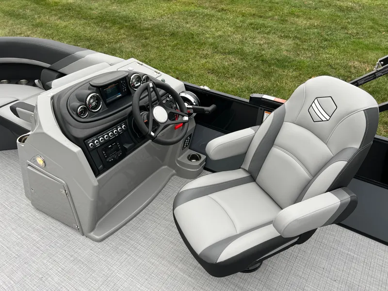 Slide: The Image of 2025 South Bay S222 UL boat interior with modern steering console and comfortable captain's chair. - 19