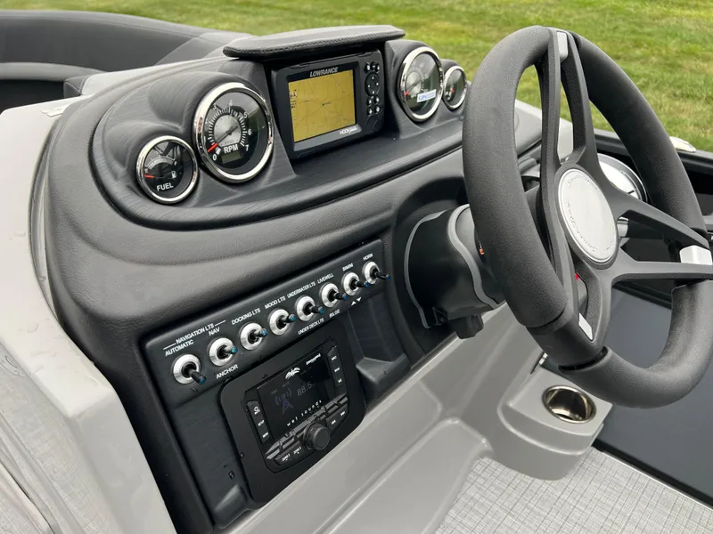 Slide: The Image of 2025 South Bay S222 UL boat dashboard with steering wheel and control panel. - 21
