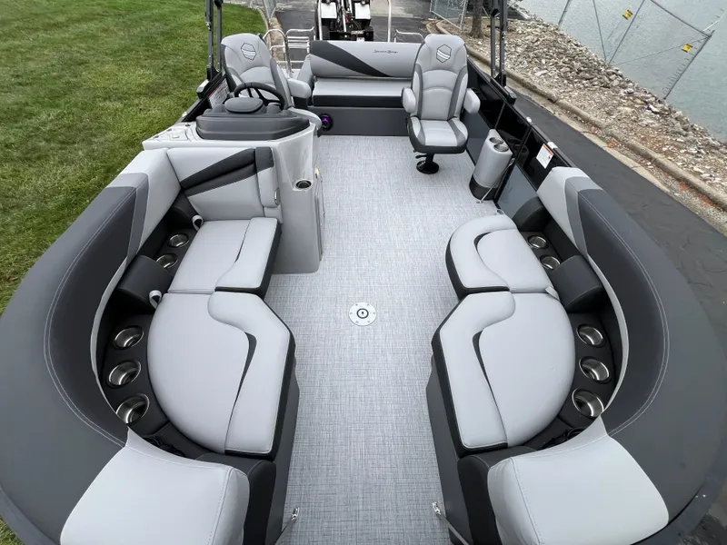 Slide: The Image of 2025 South Bay S222 UL pontoon boat interior with gray seating and modern design. - 7