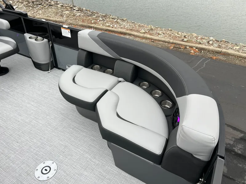 Slide: The Image of 2025 South Bay S222 UL pontoon boat with stylish seating and cup holders. - 8