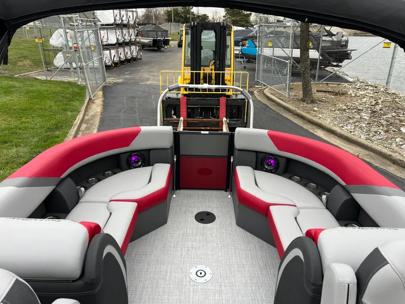 Slide: The Image of 2025 South Bay S222 RS Tri 3.0 pontoon boat with red and gray seating. - 11