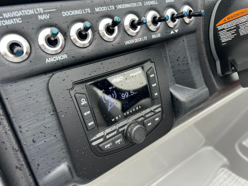 Slide: The Image of Control panel of 2025 South Bay S222 RS Tri 3.0 with radio and switches. - 16